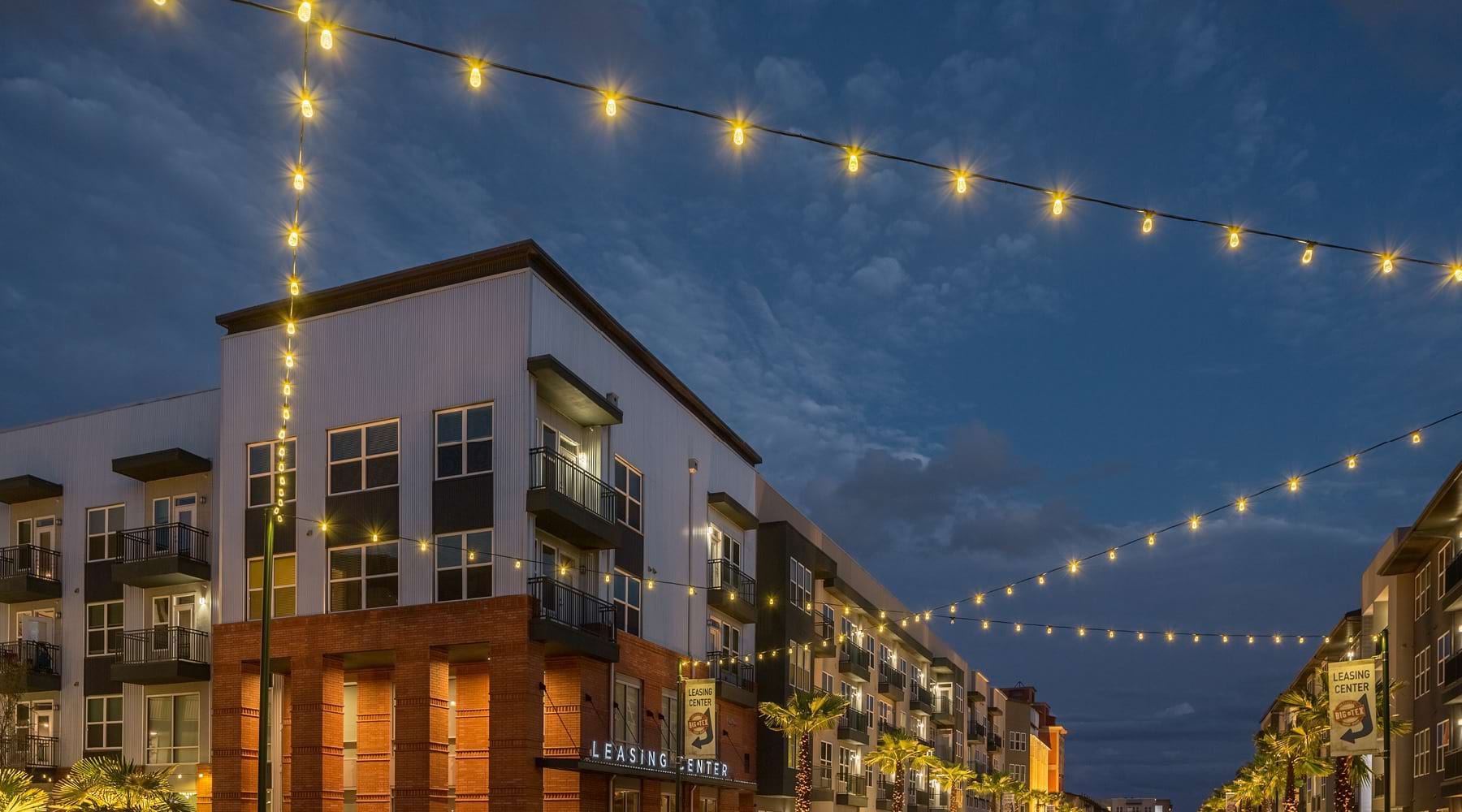 a building behind a string of lights