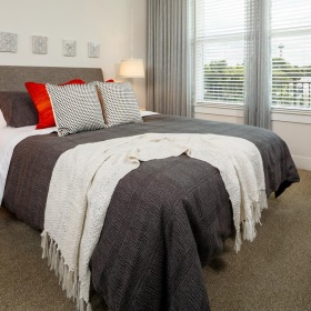 Bedroom options to fit every lifestyle a bedroom with a bed and a window